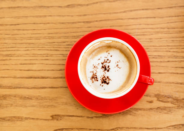 istock cup of fresh espresso on wood table, view from above 652882962