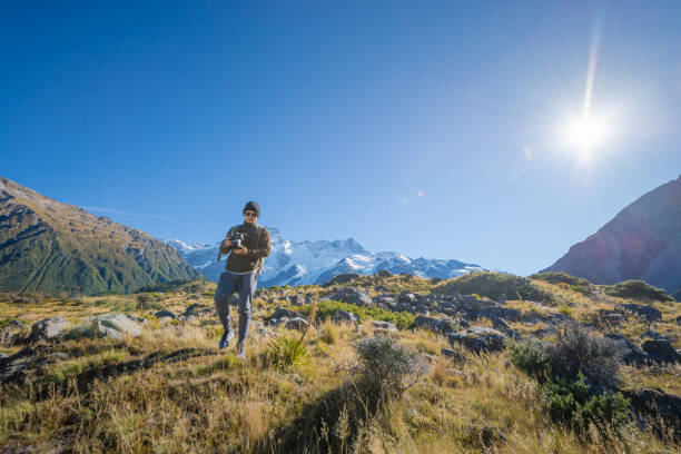 istock Young travler taking photo at mt cook mountain 652885808