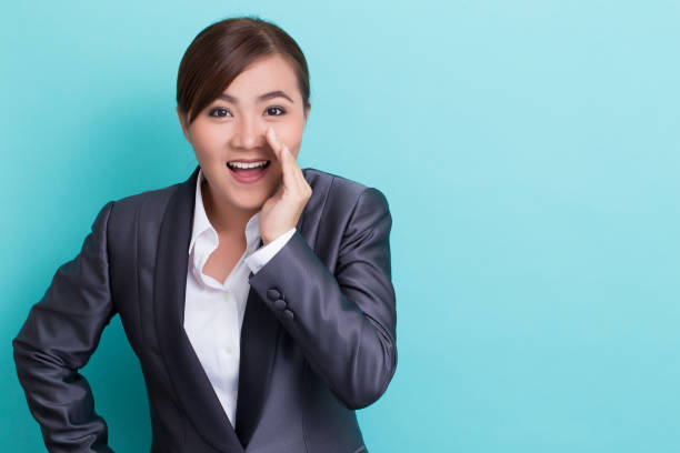 istock Businesswoman make gossip gesture 652886342