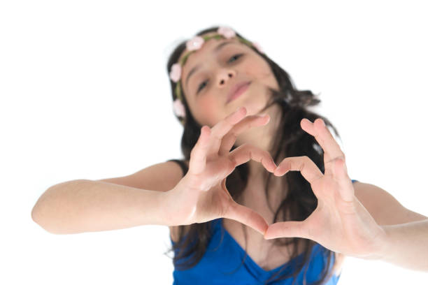 istock Little Girl Doing Heart With Hands 652892350