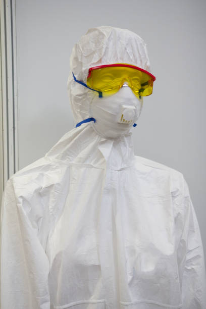 istock Mannequin in white protective clothing, respirator and plastic glasses 652895948