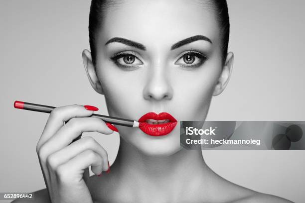 Black And White Photo Of Woman Painting Lipstick Stock Photo - Download Image Now - Black And White, Make-Up, Manicure