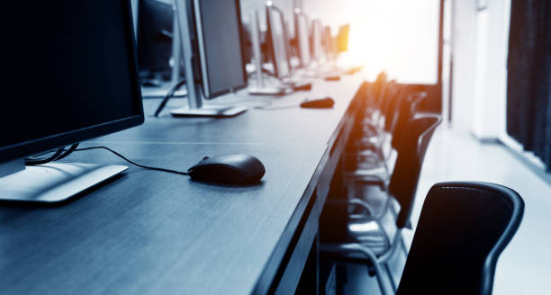 computer room Row of computers at an university computer room. computer lab stock pictures, royalty-free photos & images