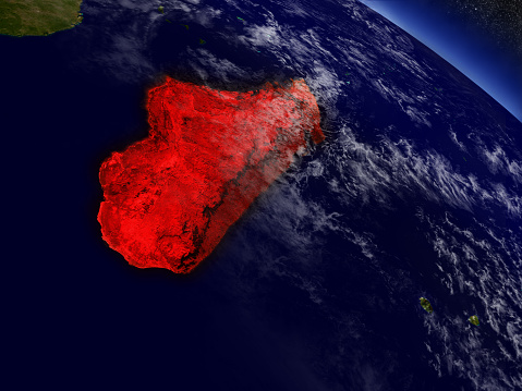 Madagascar highlighted in red as seen from Earth's orbit in space. 3D illustration with highly detailed planet surface. 3D model of planet created and rendered in Cheetah3D software, 9 Mar 2017. Some layers of planet surface use textures furnished by NASA, Blue Marble collection: http://visibleearth.nasa.gov/view_cat.php?categoryID=1484