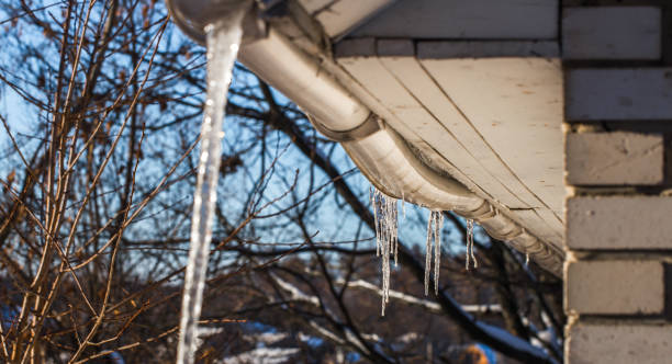 istock ice icicles on the roofs of houses 652901008