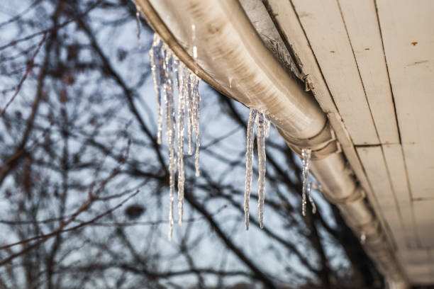 istock ice icicles on the roofs of houses 652901018