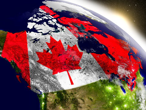 Canadá con bandera en sol naciente photo