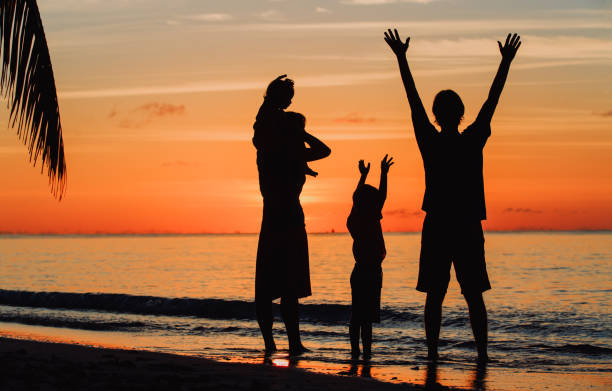 istock happy family with two kids on sunset beach 652915348