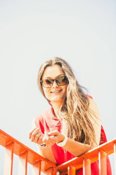 istock Girl on bridge in city. 652924318