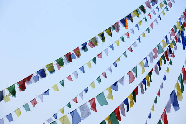 istock Buddhist tibetan prayer flags waving in the wind against blue sky. 652925566