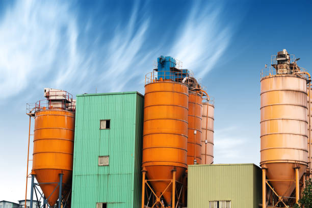 istock Cement factory machinery on a clear blue day 652931918