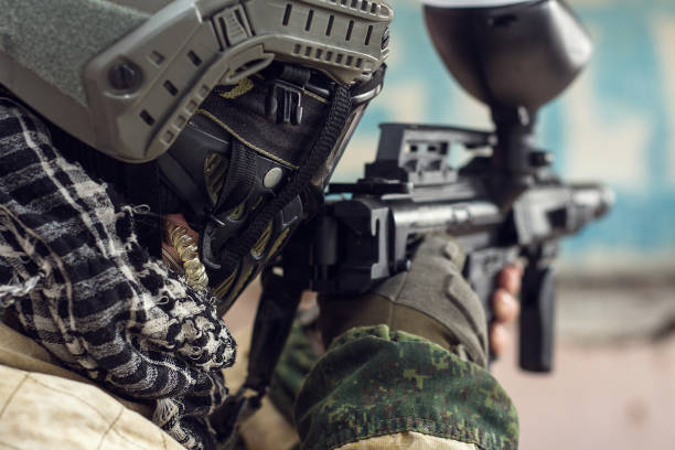 istock Soldier in military camouflage takes aim with gun 652935488