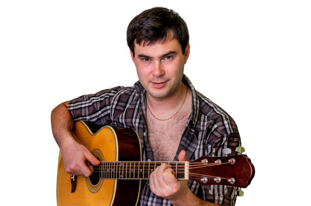 istock Young man playing acoustic guitar - isolated on white 652936558