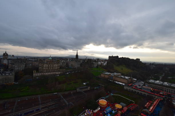 Top view of Edinburgh covered clouds and the Castle in the evening, Edinburgh, Scotland, United Kingdom