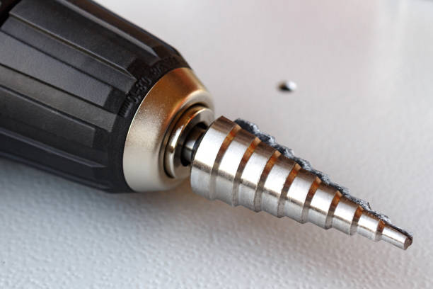 istock Step drill in the chuck of the screwdriver 652943132