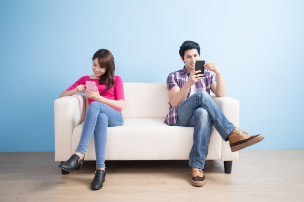 istock young couple play phone happily 652945882