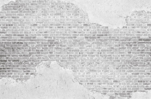 vintage imbiancato intonacato vecchio muro di mattoni sfondo strutturato. - brick wall old brick wall foto e immagini stock