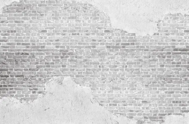 Vintage  whtewashed plastered  old  brick wall  textured background.
