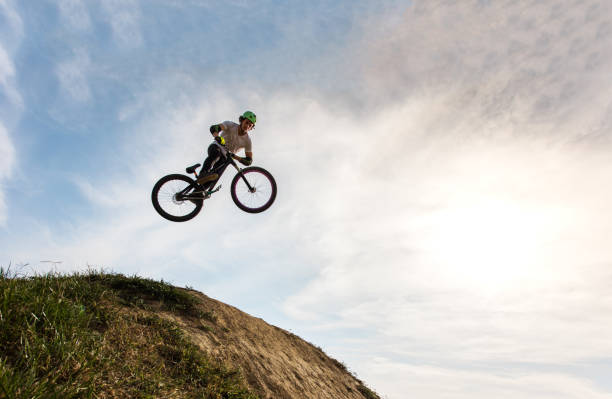 istock Skillful man on bike jumping against the sky. 652946534