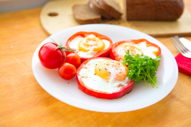 istock Fried eggs in paprika served on white plate 652947240