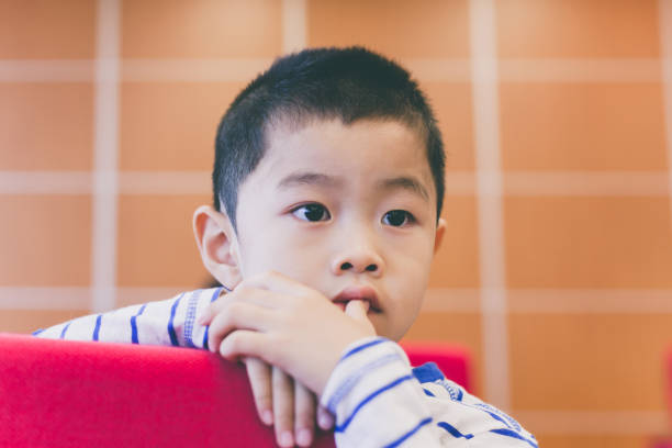 istock Cute boy sitting in meeting room 652952370