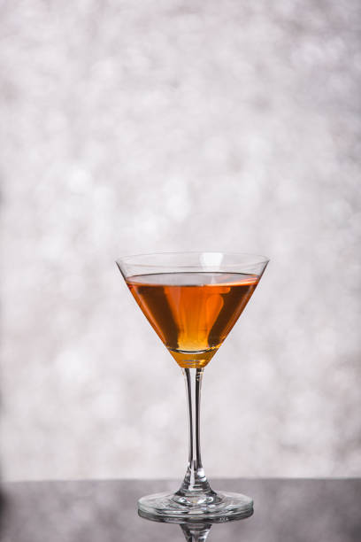istock Evening drink. glasses with red liqueur on bokeh background 652953124