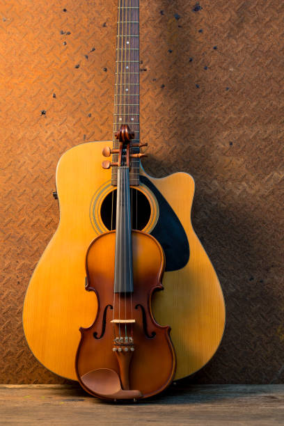 istock Acoustic guitar on old steel  background 652953492