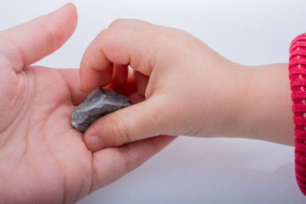 istock Hand holding little stone in hand 652953566