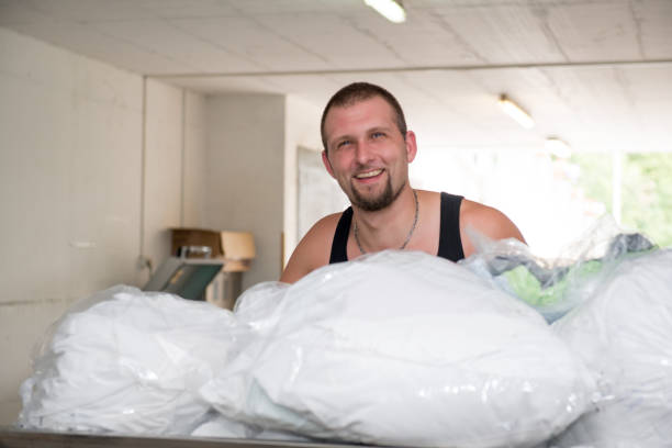 istock Maintainer Transporting Laundry In The Nursery Home 652954056