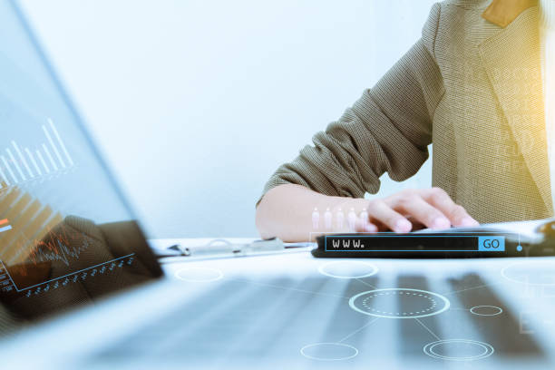 istock business documents on office table and graph business diagram and business people working in the background,business content,business background. 652976474