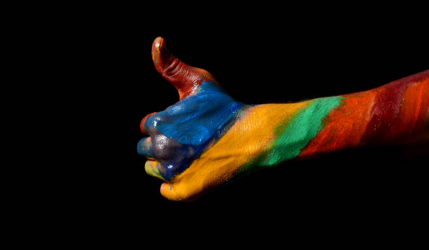 istock Multi Colors painted hand Thumbs Up Gesture on black background 652986452