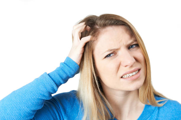 istock Studio Shot Of Young Woman Itching Scalp 652994394