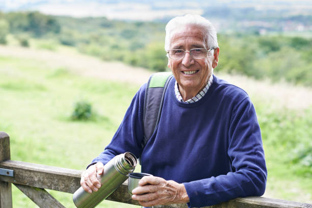 istock Senior Man On Hike Having Hot Drink 653004256
