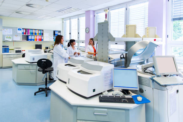 istock Three cute Technicians in laboratory of blood bank discussing 653004374