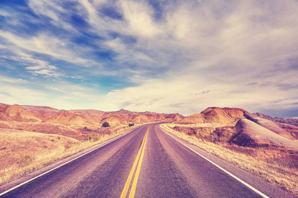 istock Color toned scenic road, travel background. 653008708