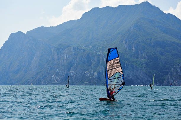 08/11/2014 Italy. A windsurfing on Lake Garda in Torbole resort. Lago di Garda is popular lake for water sports
