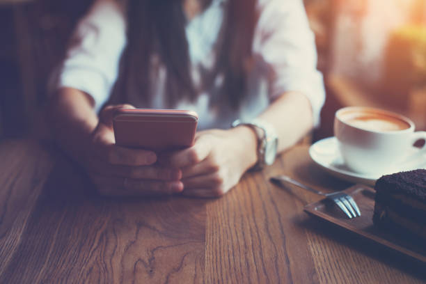 istock Close-up of mobile phone in woman's hands 653015014