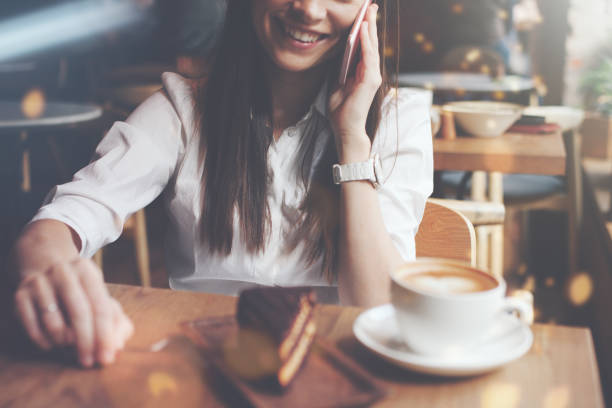 istock Woman talking on the phone in cafe 653015114