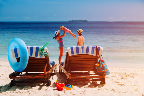 istock chairs on tropical beach, family beach vacation 653015168