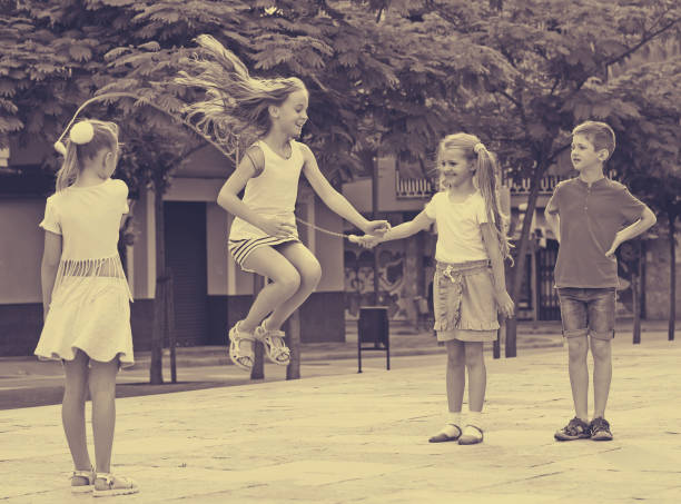 istock children with jumping rope at playground 653018194