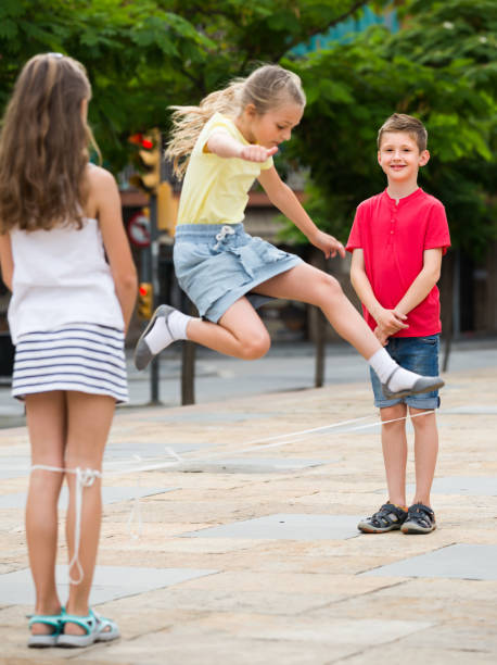 istock children with chinese jumping rope 653018352