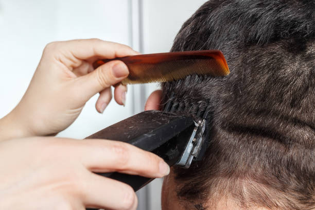 istock man haircut by clipper and comb 653027166