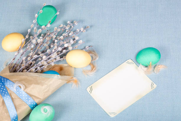 istock Easter background with colorful eggs and pussy willow in pastel shades 653029604