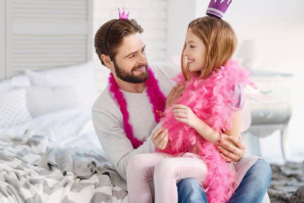 istock Delighted family members smiling to each other 653030246