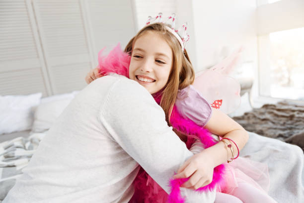 istock Very attractive little princess hugging her dad 653035712
