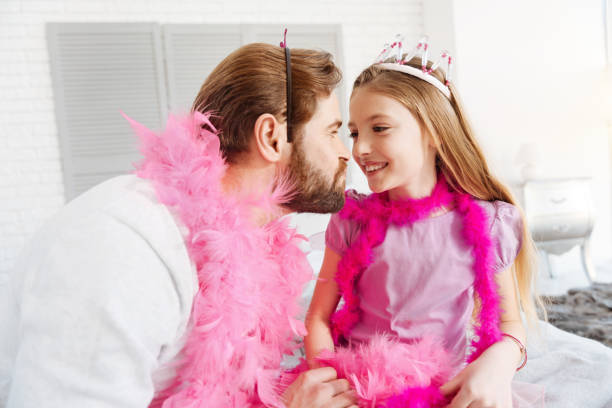 istock Portrait of funny daddy playing with his daughter 653035784