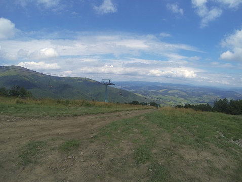 Mountains. Ski lift. GoPro quality. Blurry in motion picture. Horizontal.