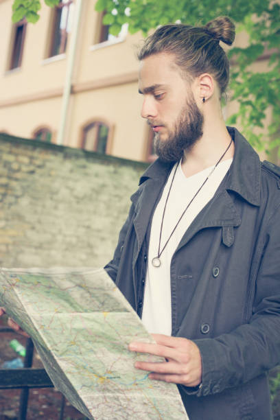 istock Tourist looking for places on a map. 653041406