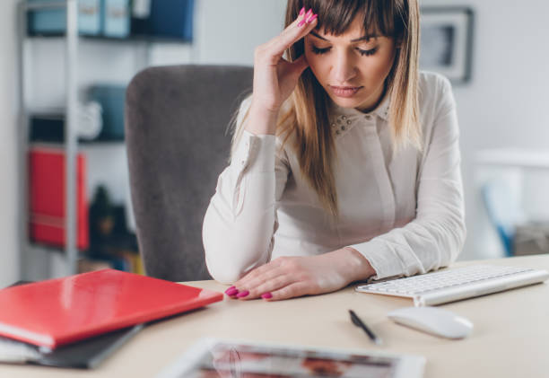 istock Stressed businesswoman in office 653050648