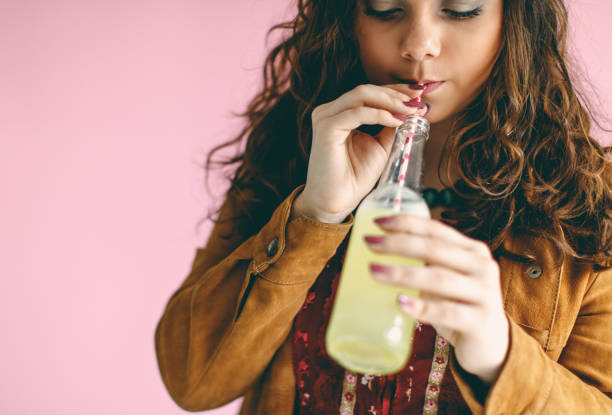 istock Smiley woman with bottle of soda 653051604